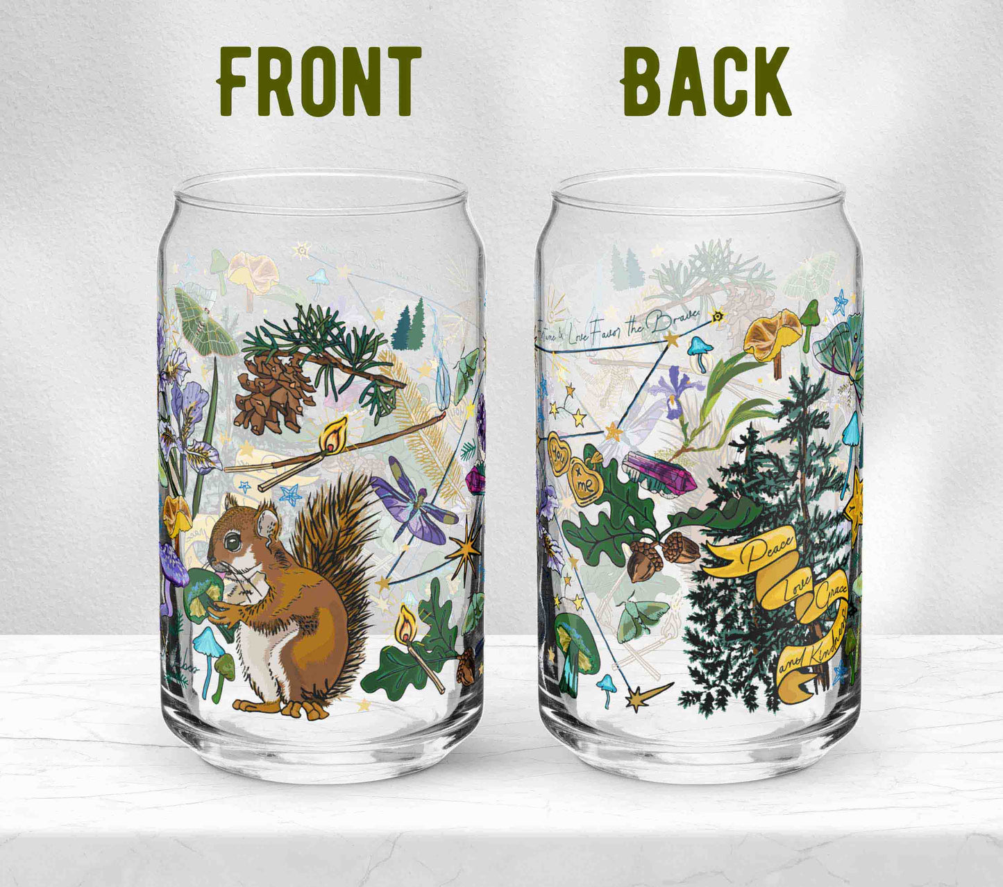 Two glasses sitting on marble. Each one is turned in a different direction to show the front and back of the design. In addition to the Cynus Constellation foretells good omens, the artwork includes a cheeky squirrel eating a green mushroom, pinecones, dragonflies, burning matches, oak leaves, acorns, iris flowers, pine trees, crystals, a locket that says "You + Me", moths, and other symbols of good fortune.