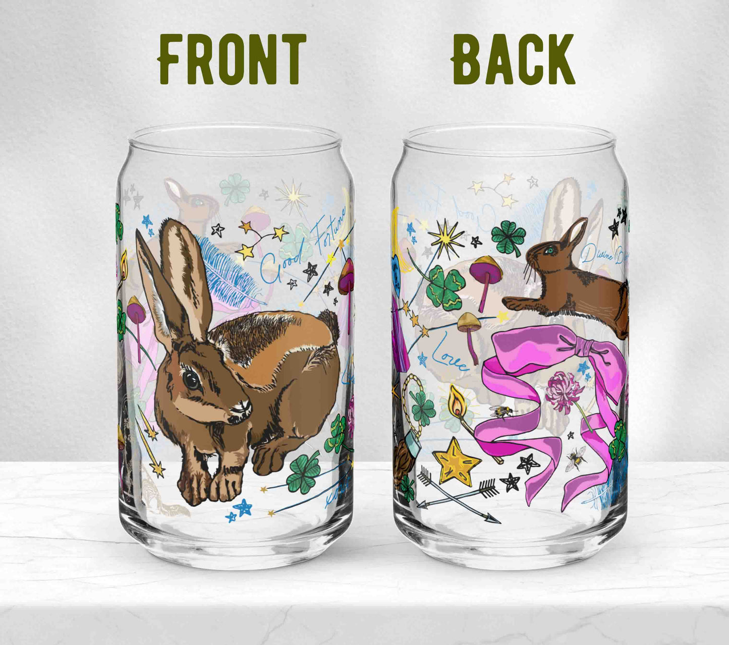 Two glasses sitting on marble. Each one is turned in a different direction to show the front and the back of the design.