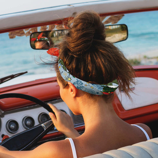 Girl driving a convertible with her hair tied up with the Aquarius bandana scarf.