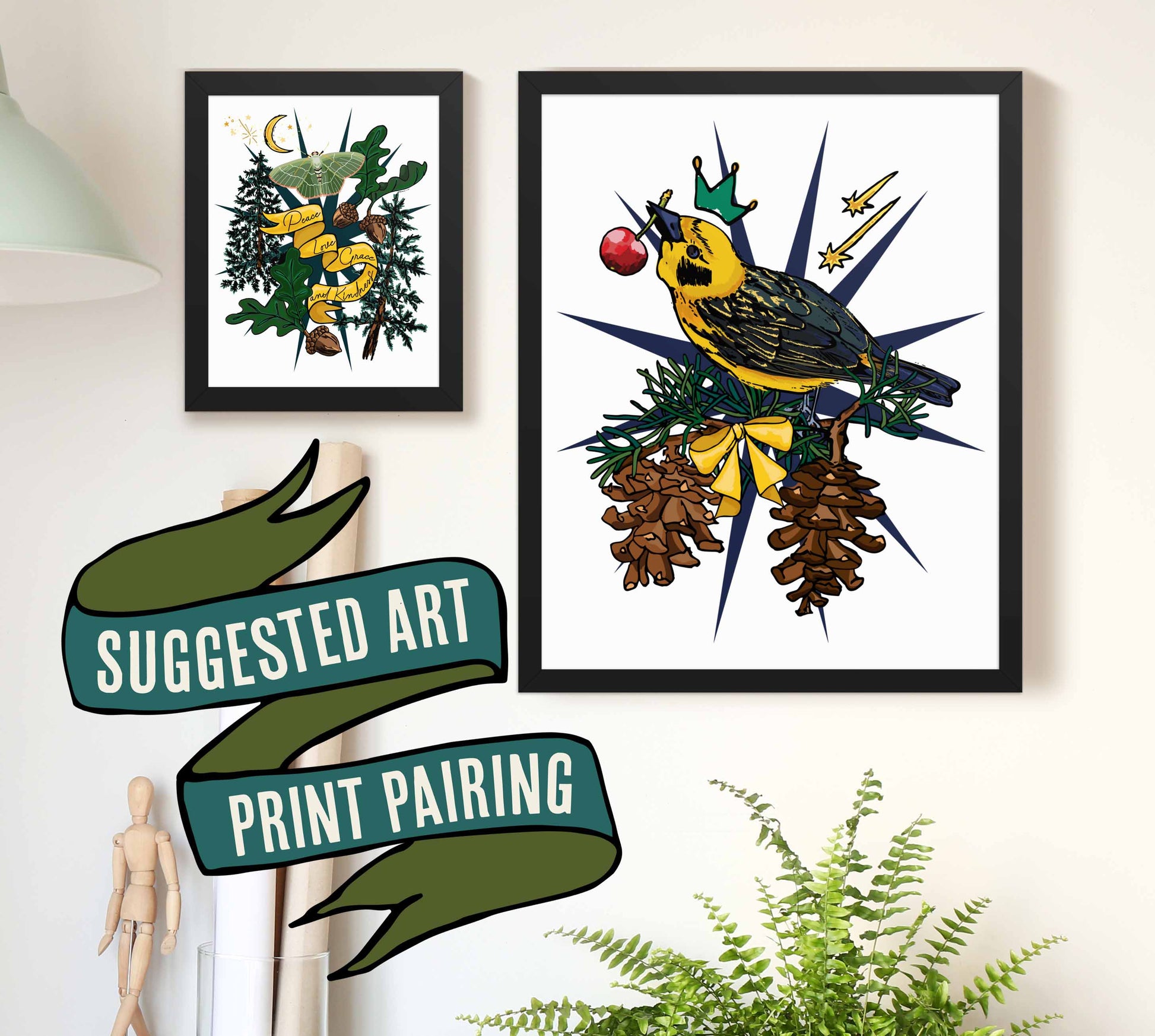 This is a photograph of two framed art prints from the Posh Pad Appalachian Rococo collection with a ribbon stating that this is a suggested art print pairing. The two prints in the photo are the Golden Finch Bird paired with the Crescent Moon & Moth art print.