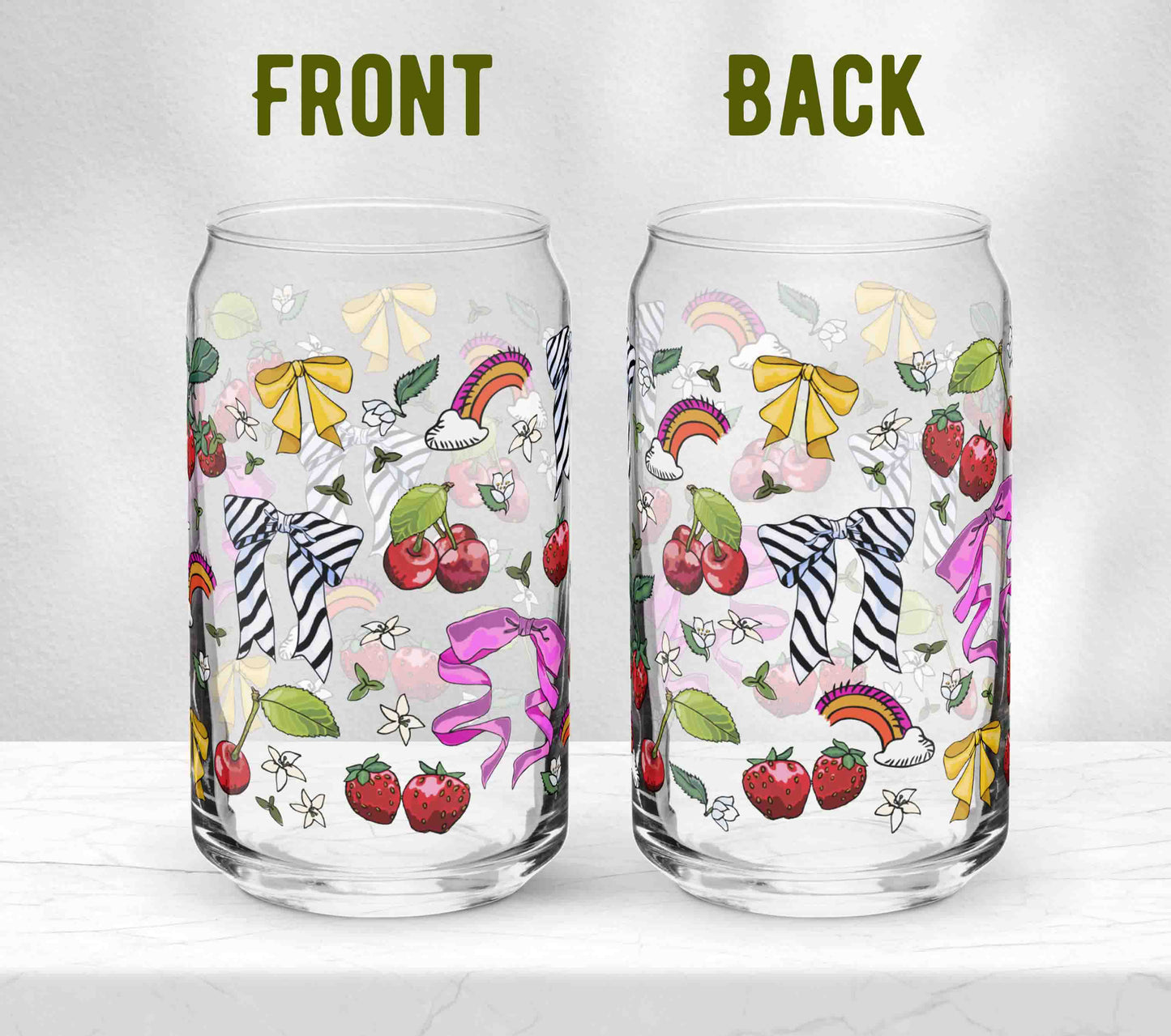 Two glasses sitting on marble. Each one is turned in a different direction to show the front and the back of the design.