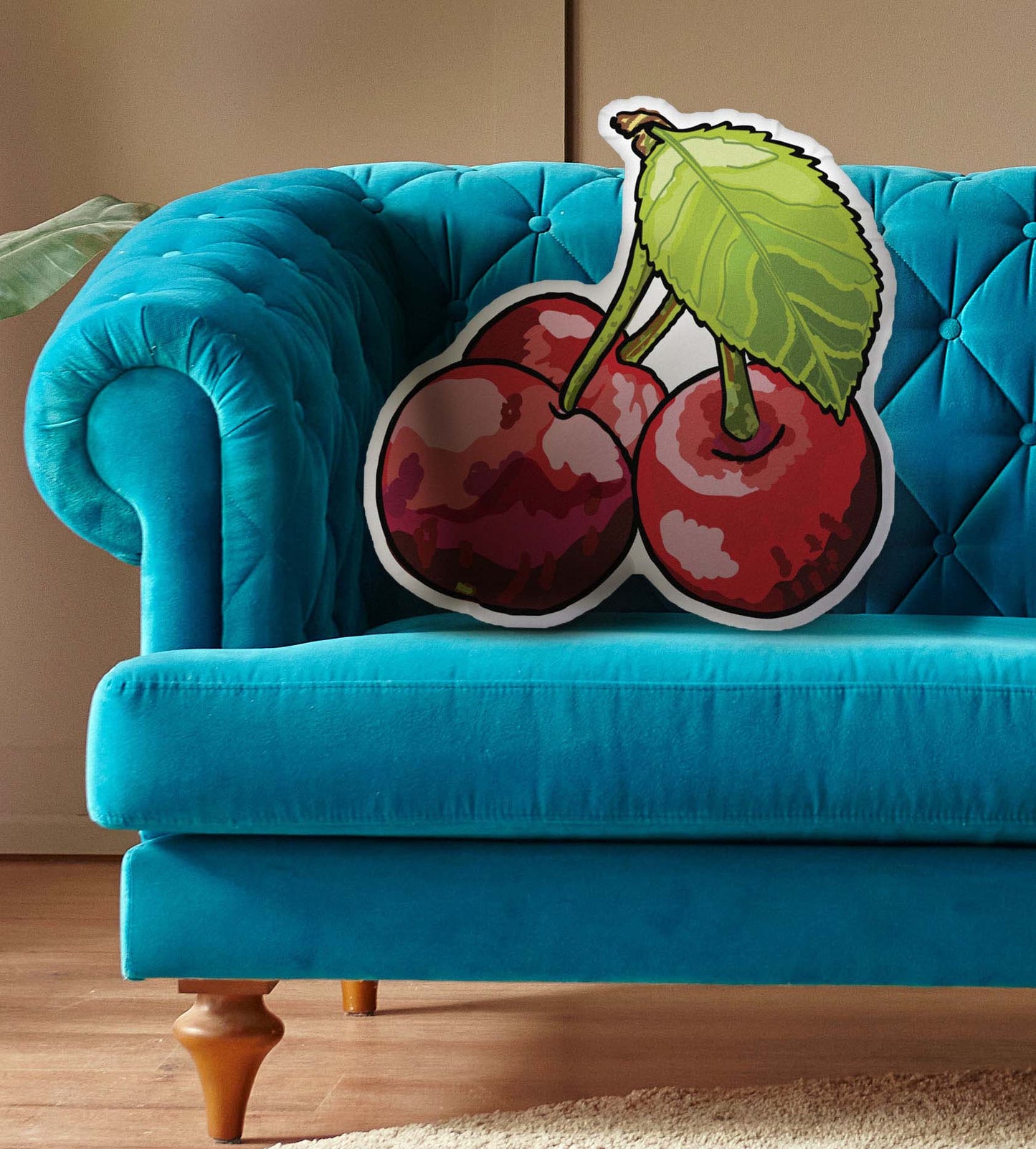 This shows the cherry-shaped pillow on couch.