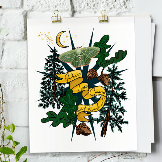 Moon & Moth art print hanging from a white bring wall with gold clips.