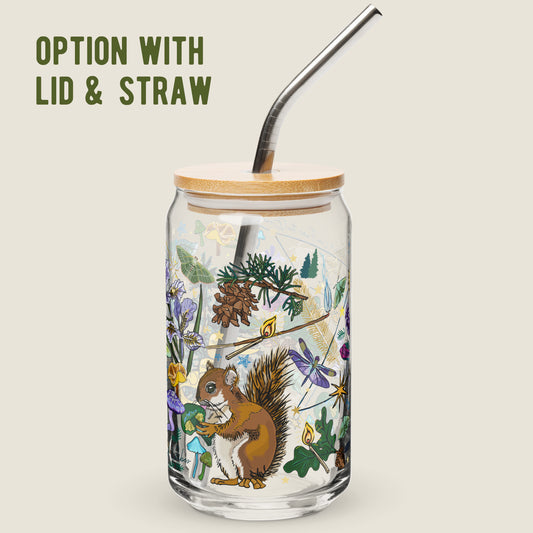 Cygnus Constellation glass tumbler with the lid and straw option on an ivory background. The artwork on the glass is an illustration of the Cygnus Constellation, considered by sailors to be a good omen. The illustration includes a cheeky squirrel eating a green mushroom, pinecones, dragonflies, burning matches, oak leaves, acorns, iris flowers, pine tress, and other symbols of good fortune. The color palette is primarily forest greens, deep turq