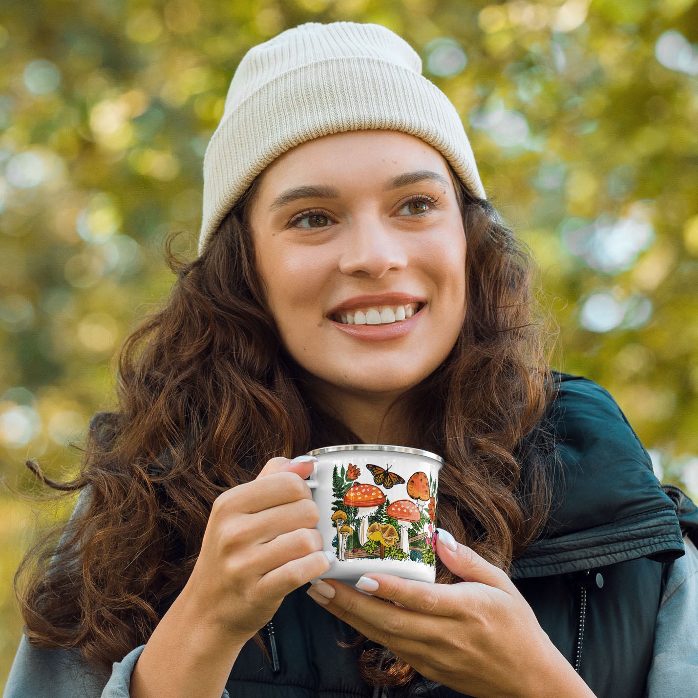 Female hiker holding the red mushroom camp coffee mug.
