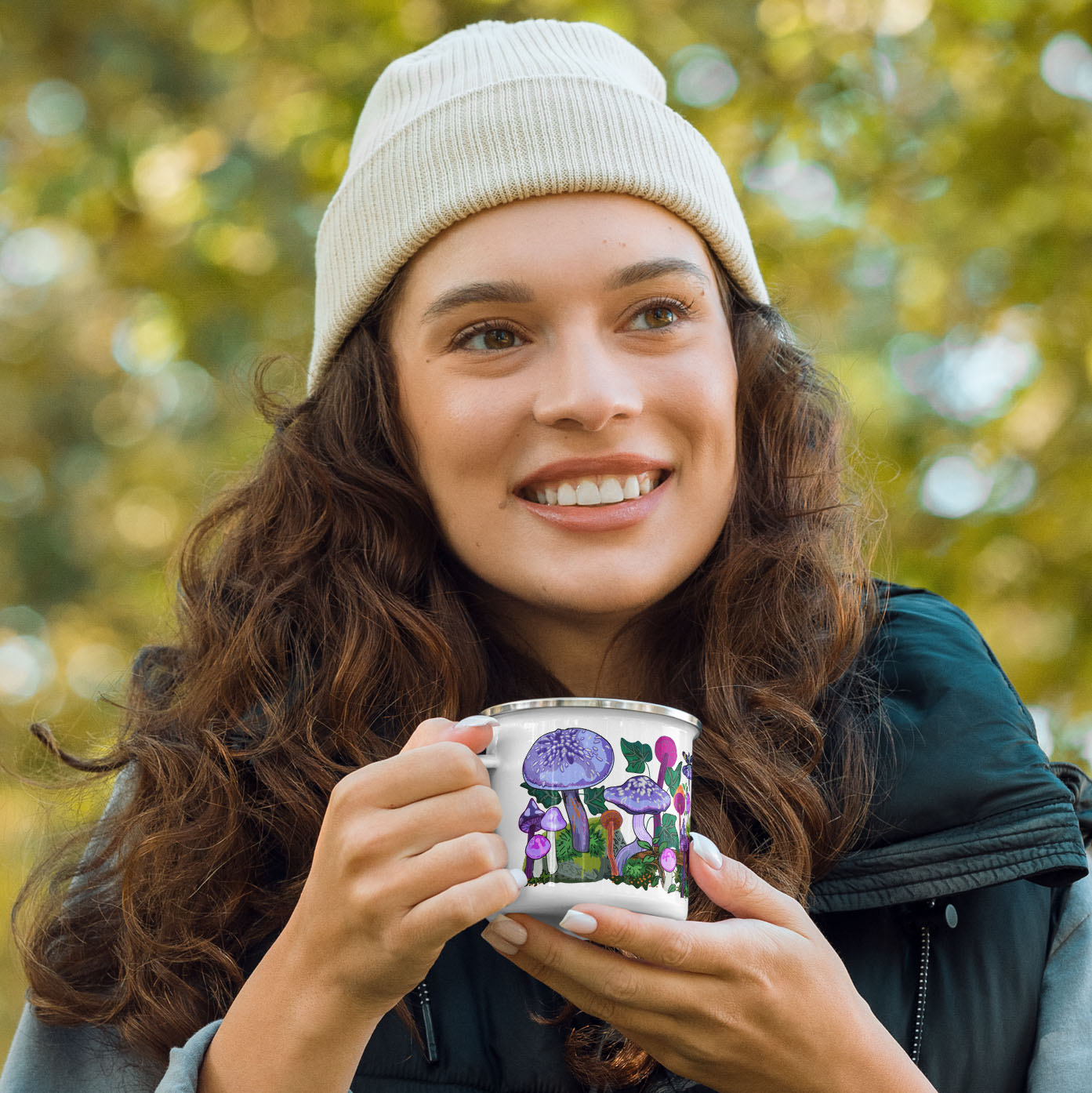 Female hiker holding the purple mushroom camp mug.