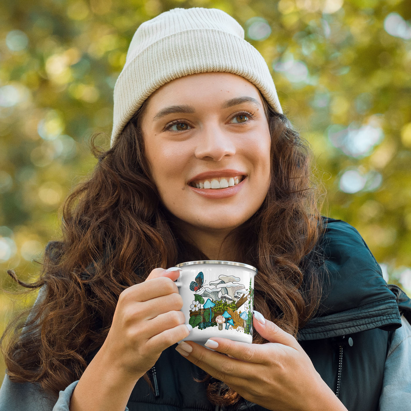 Female hiker holding the enamel camp mug.