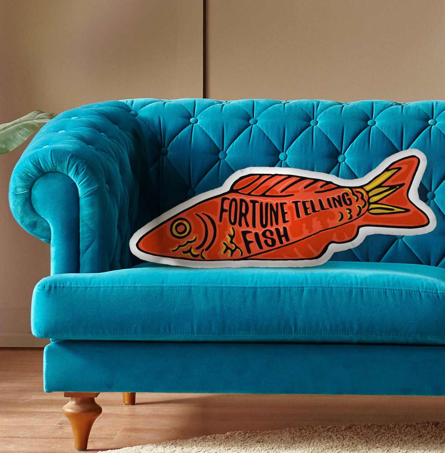 This photo shows the pillow on a bright blue couch.