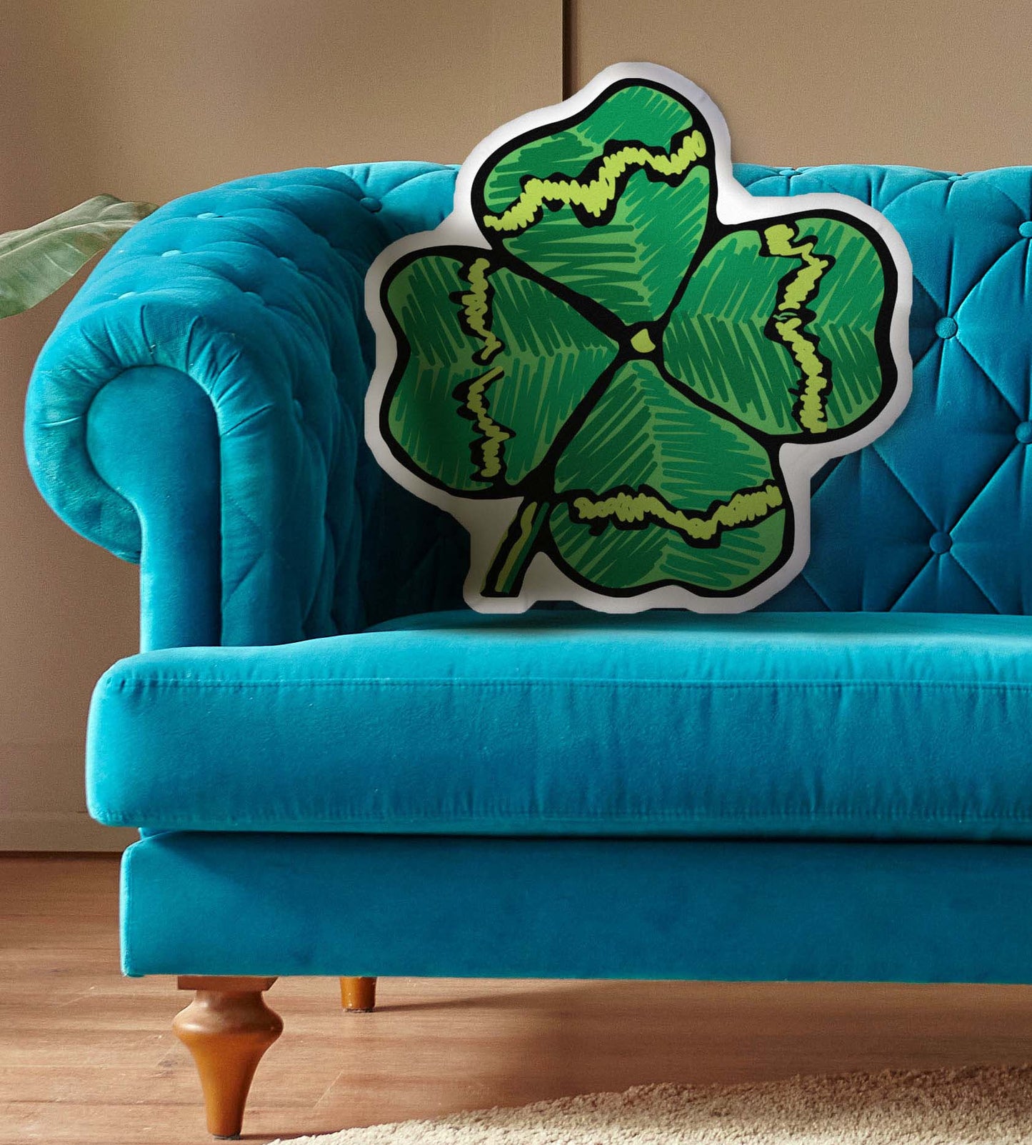 This photo shows the pillow on a bright blue couch.