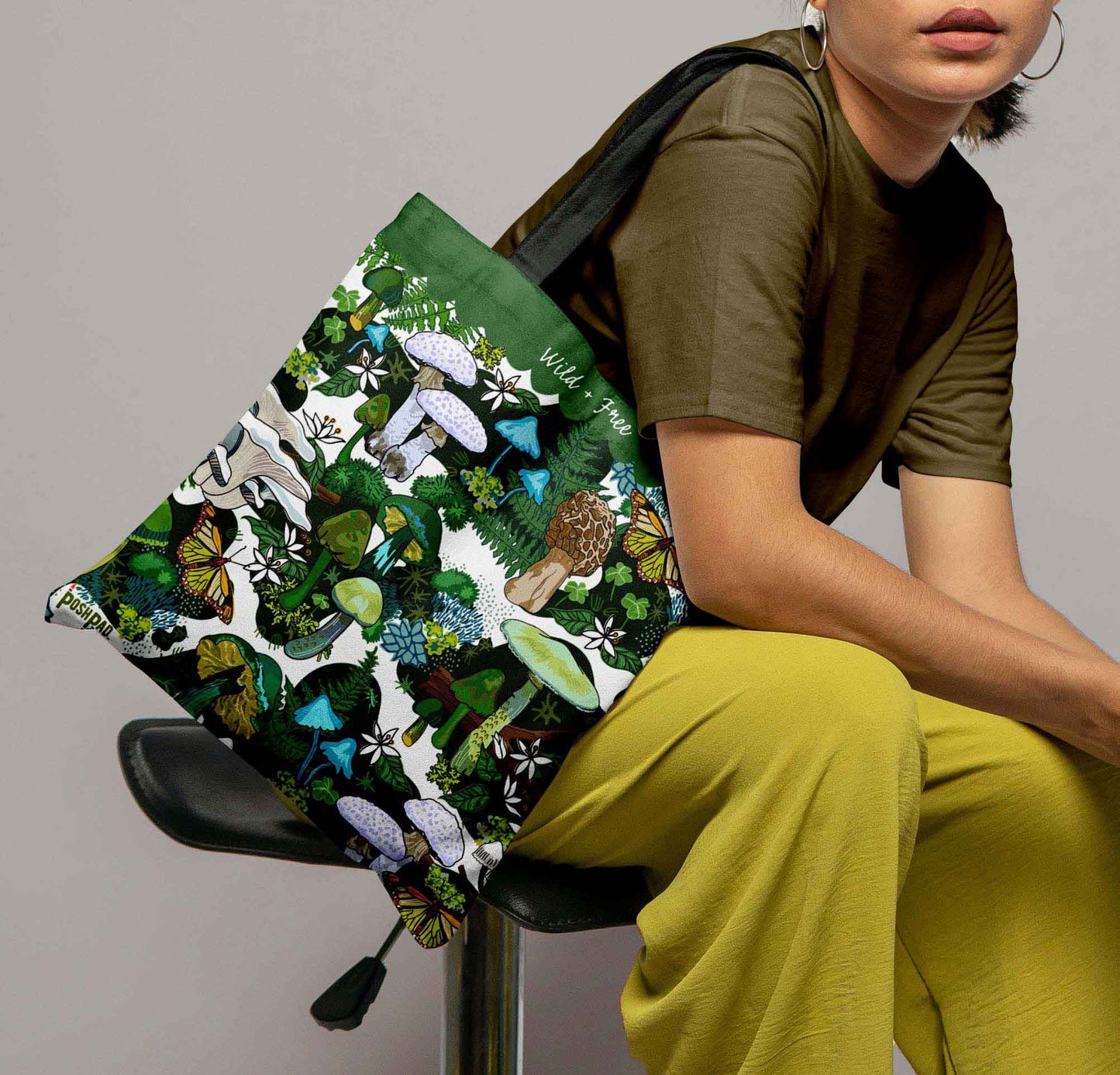 This is a photo of a woman with the tote bag on her shoulder to show the size of the bag.