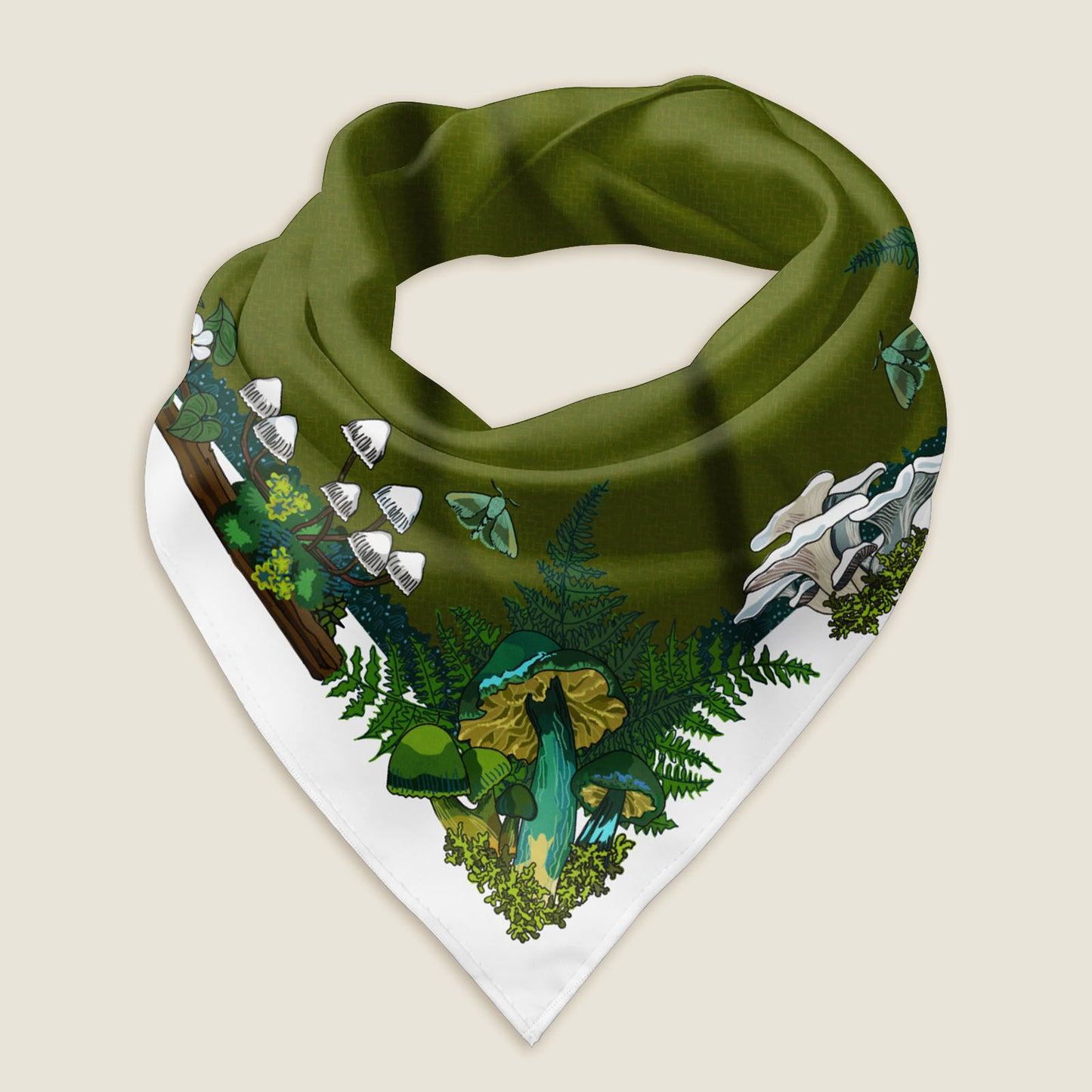 The green mushroom bandana styled as a wrap shows the details of the hand-drawn artwork, which includes a variety of green and yellow mushrooms, moths, ferns, and moss illustrated around a green middle with a white border. Behind the scarf is a green background with illustrated pine trees and the Wander Wrap logo.