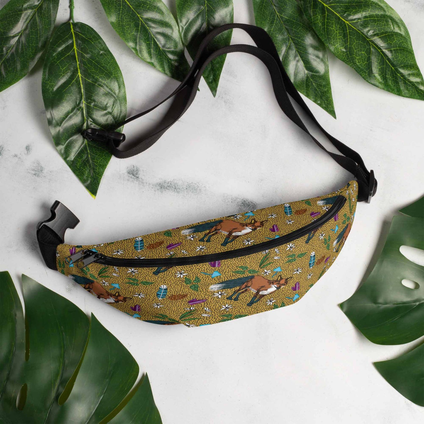 Fox hip pack on a marble table surrounded by leaves.