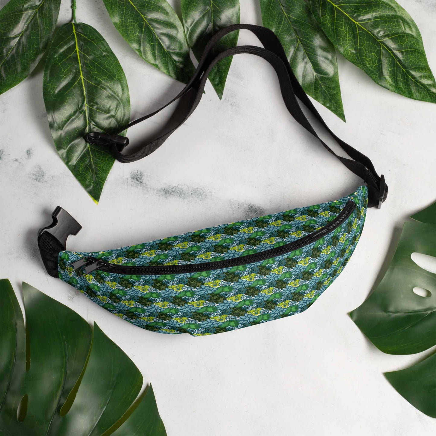 Hip pack on a marble table surrounded by leaves.