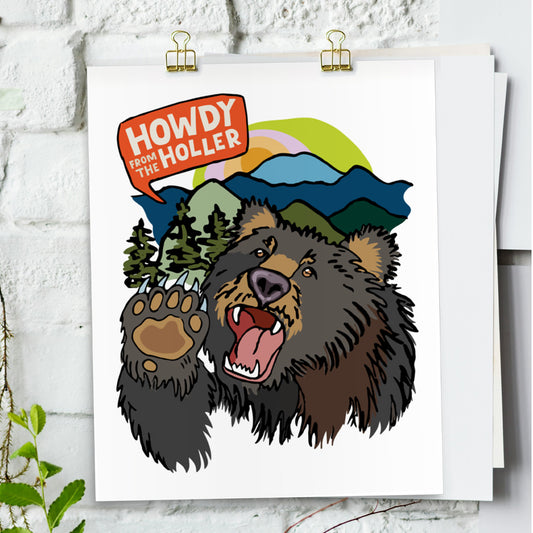 The Howdy from the Holler Bear art poster hanging on a white brick wall.