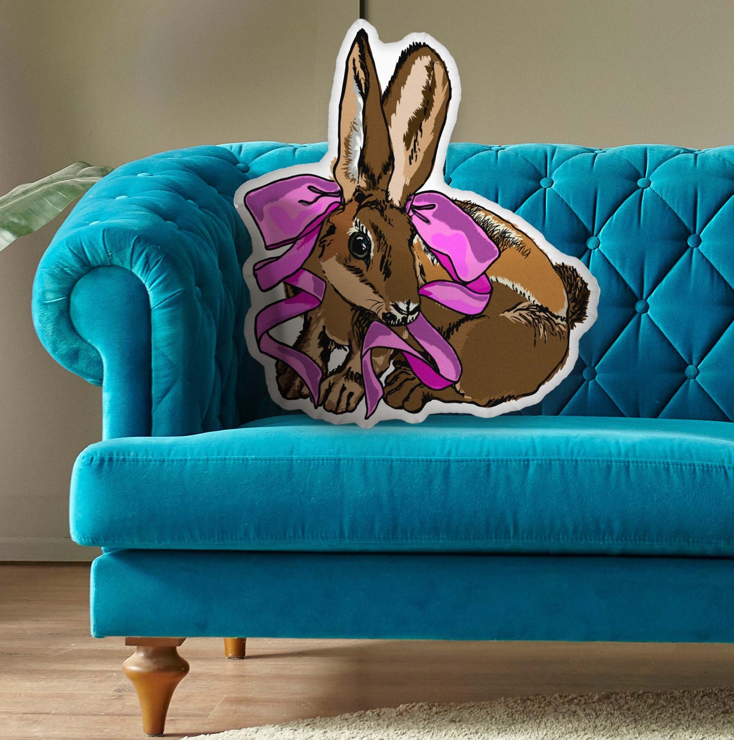 This is a photo of the shaped pillow on a blue couch.