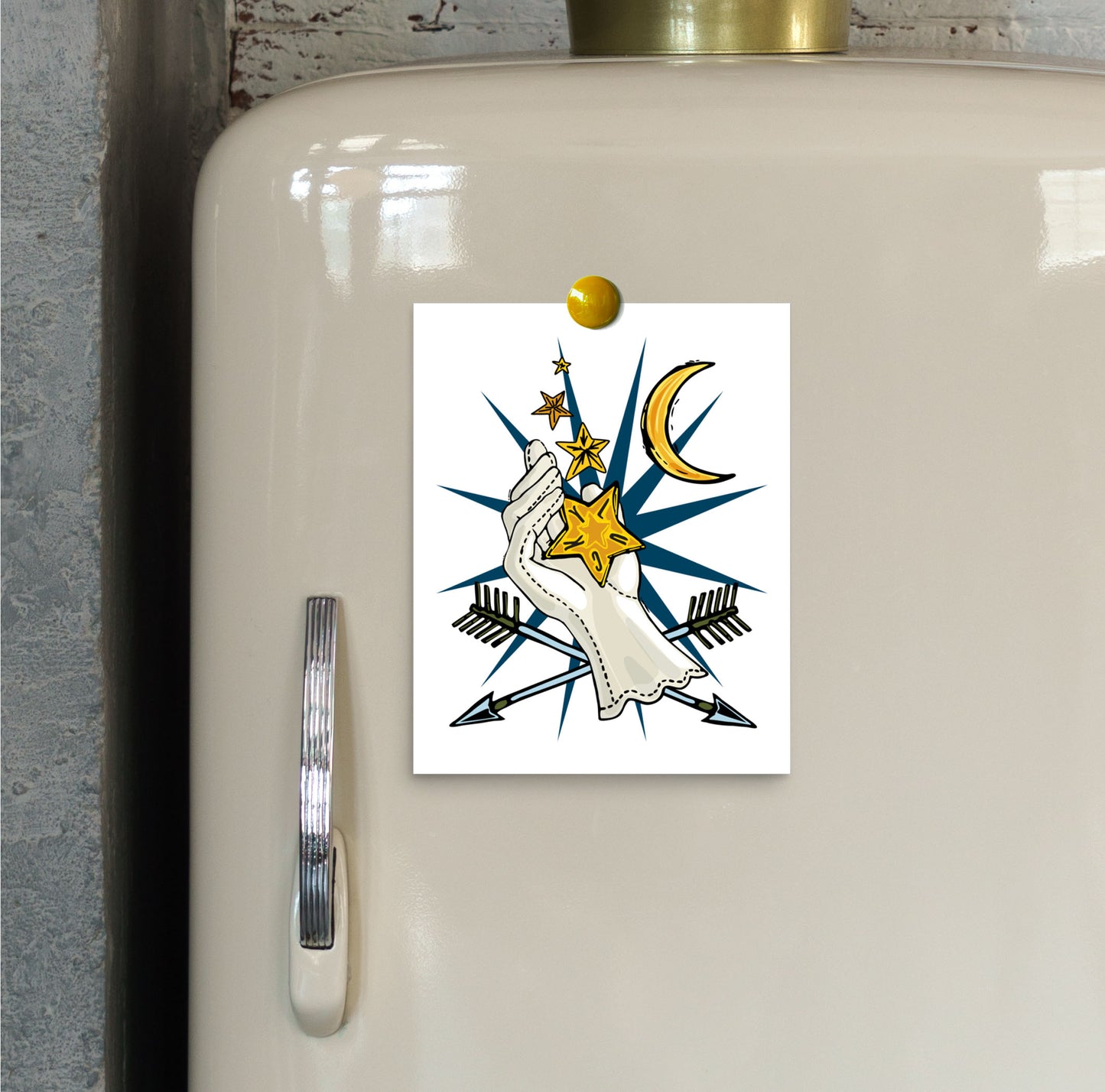 This is a close-up image the small Lucky Stars art print hung on an ivory vintage refrigerator.