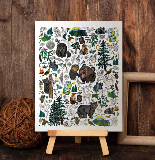 The Mountain Hikes art print sitting on a wood easel.
