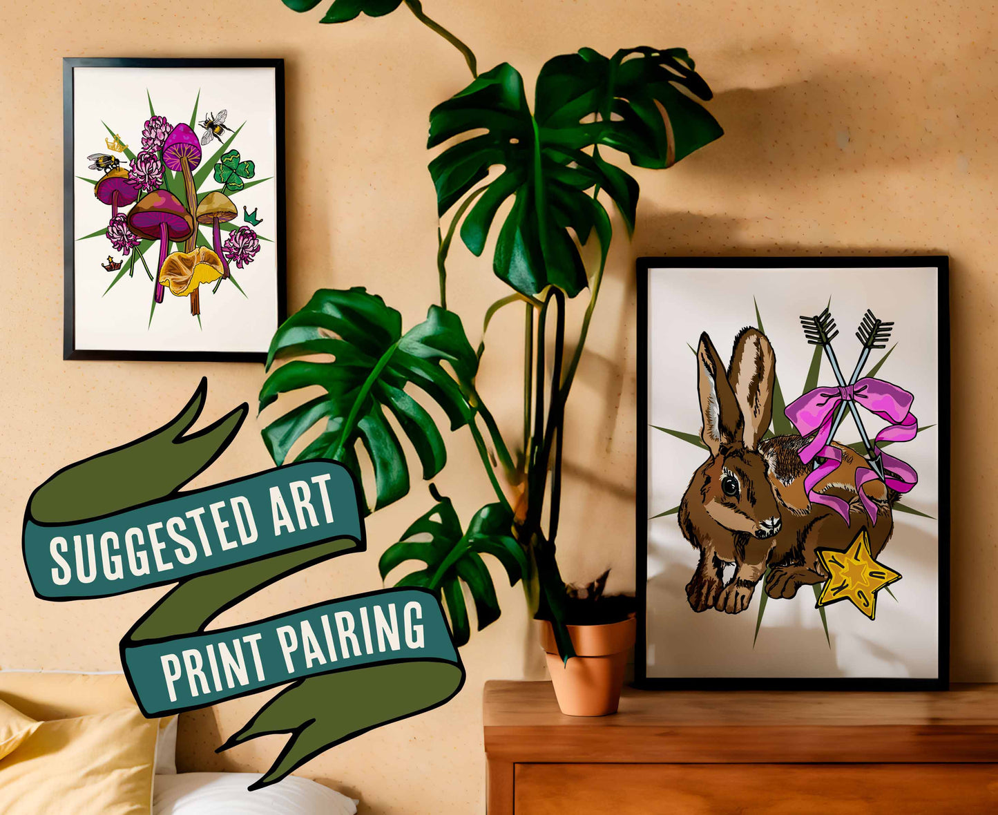 This photo shows a suggested art print pairing. This pairing shows the Lucky Rabbit's Path art print in a black frame on a dresser with a plant. The companion print is the Queen's Fvaor art print, which is in a black frame on the wall.