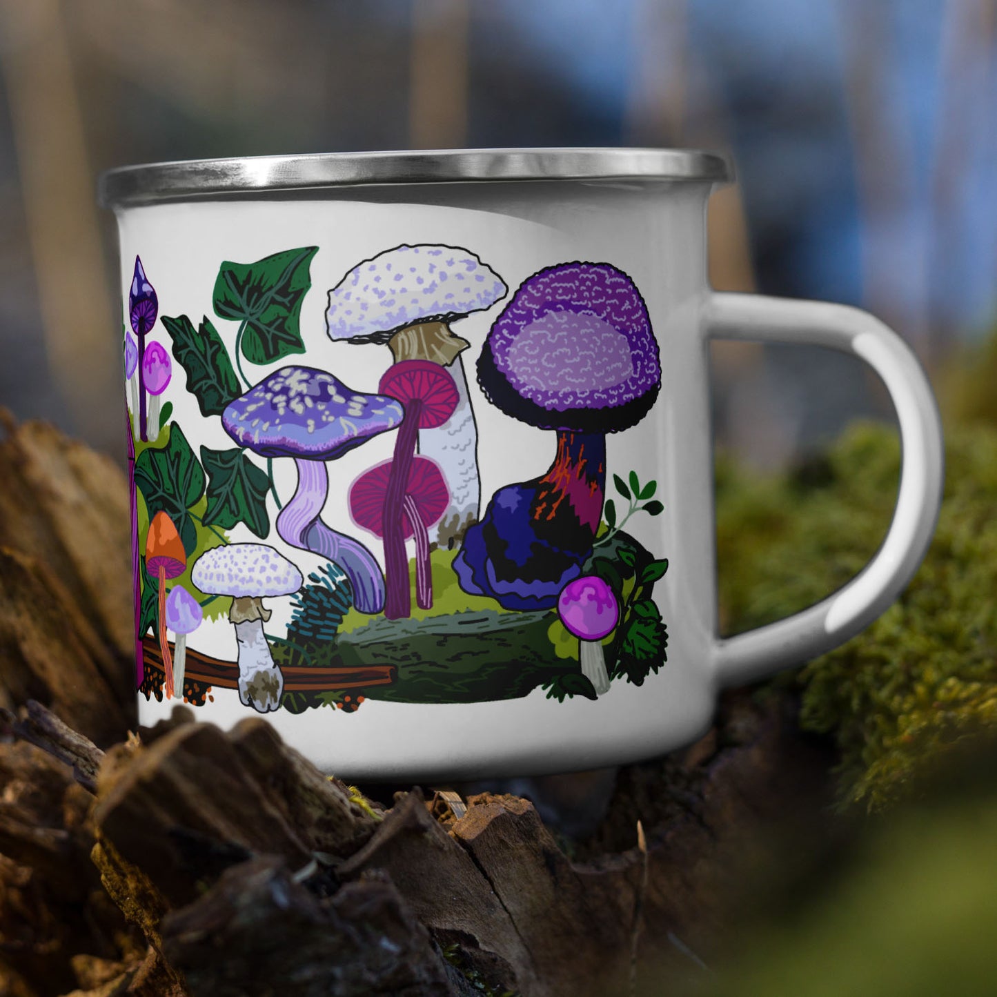 Purple mushroom enamel camp mug sitting on a tree stump.