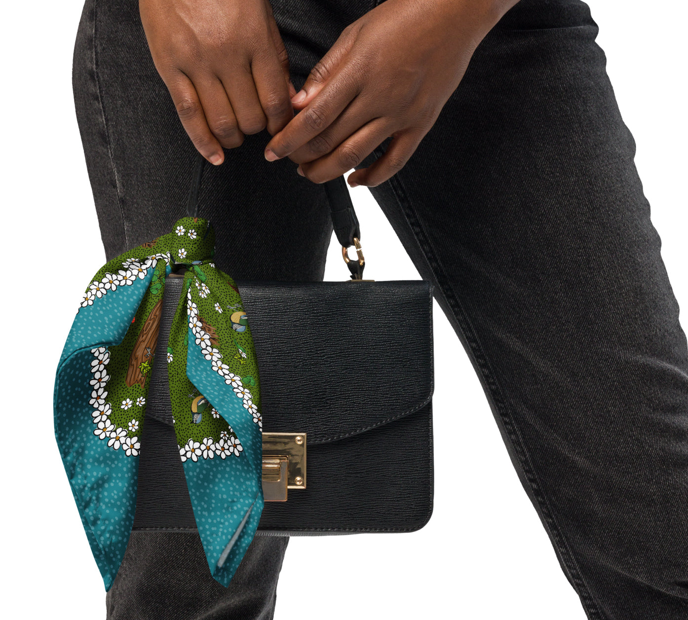 Bird bandana styled on a black purse.