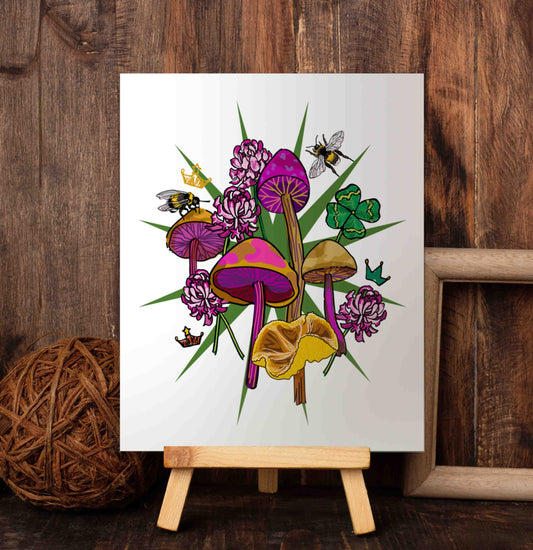 Queen Bee, Clovers, and Mushrooms art poster on a wooden easel set against a wood-paneled wall. A queen bee reigns supreme in this Appalachian-inspired Rococo illustration is rich with meaning. The queen bee is a timeless emblem of leadership, unity, and divine feminine energy, while the crown speaks to power, dignity, and excellence. Mushrooms remind us of the cyclical nature of life and four-leaf clovers bring a touch of good fortune and protection.