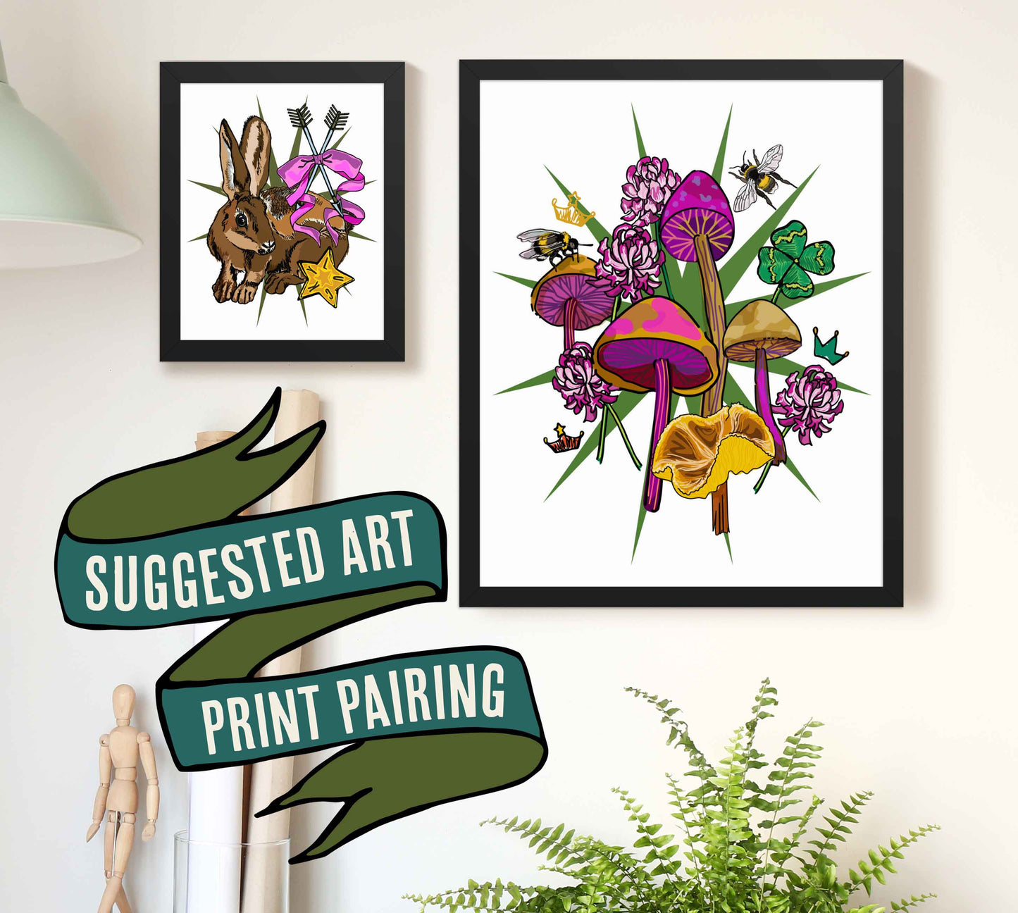 This is a photograph of two framed art prints from the Posh Pad Appalachian Rococo collection with a ribbon stating that this is a suggested art print. The two prints in the photo are the Lucky Rabbit's Path paired with the Queen Bee, Mushrooms, & Clover art print.
