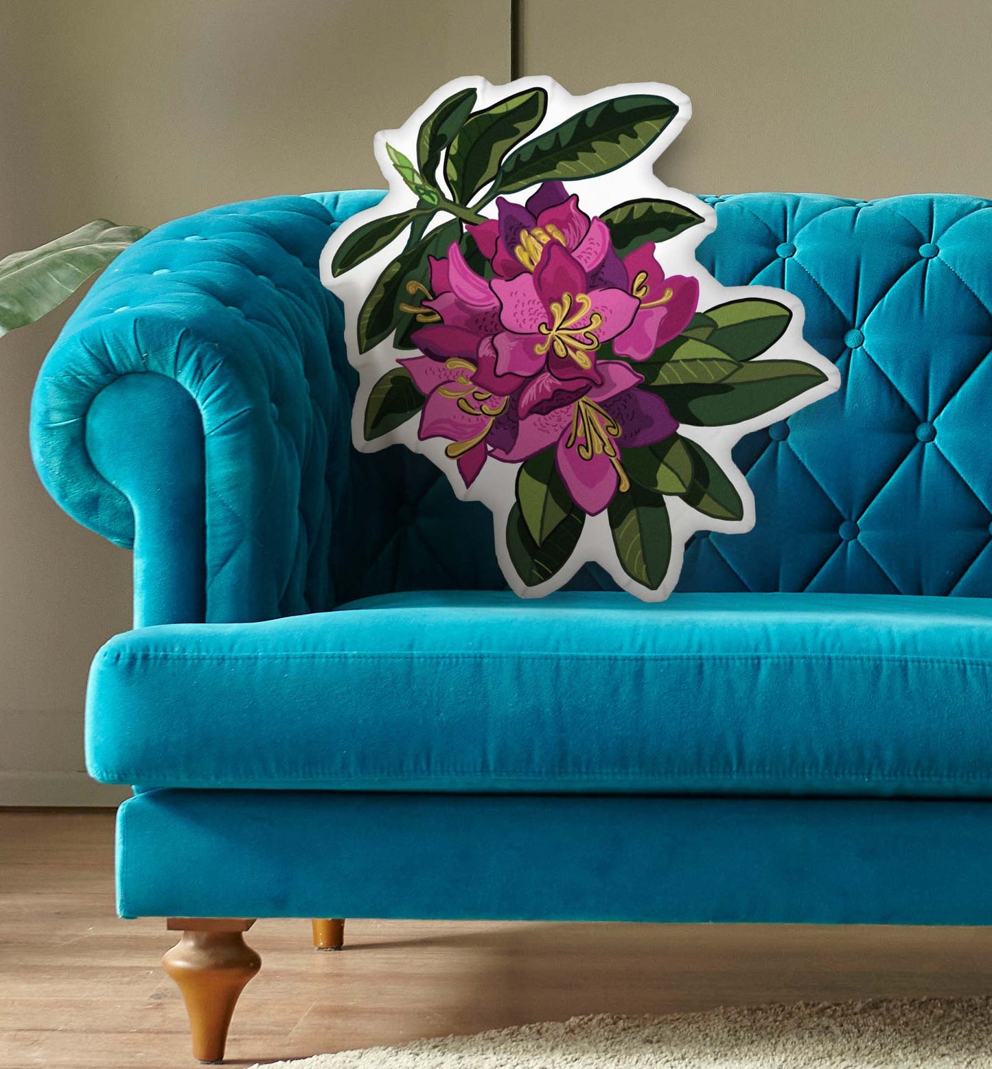 This is a photo of the shaped pillow on a blue couch.