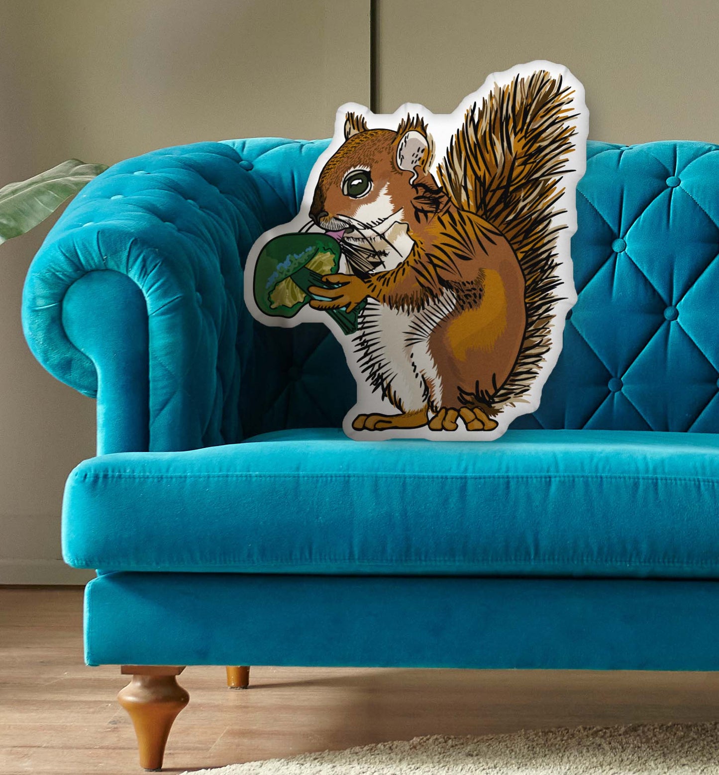 This is a photo of the shaped pillow on a blue couch.