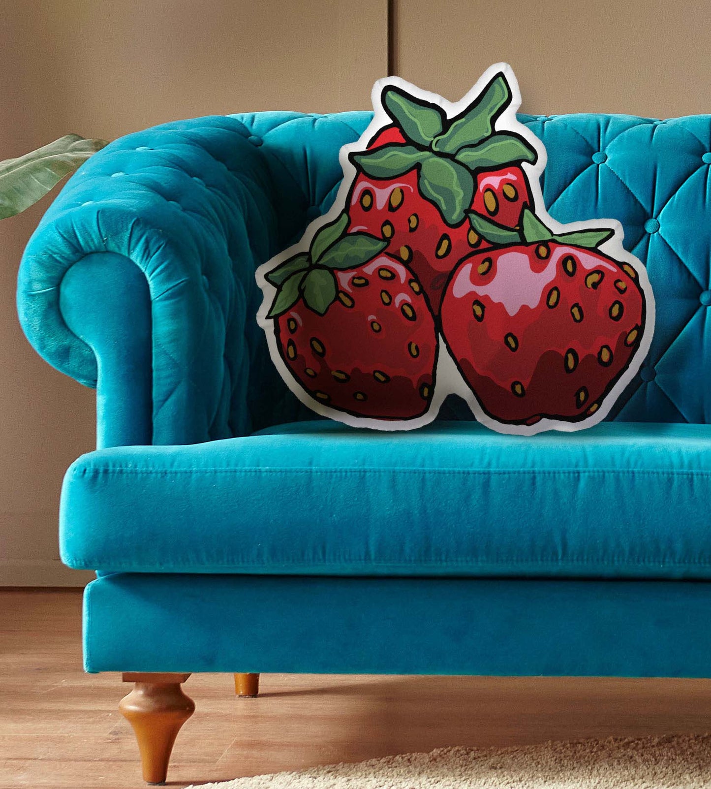 This is an image of the shaped pillow on a blue couch.
