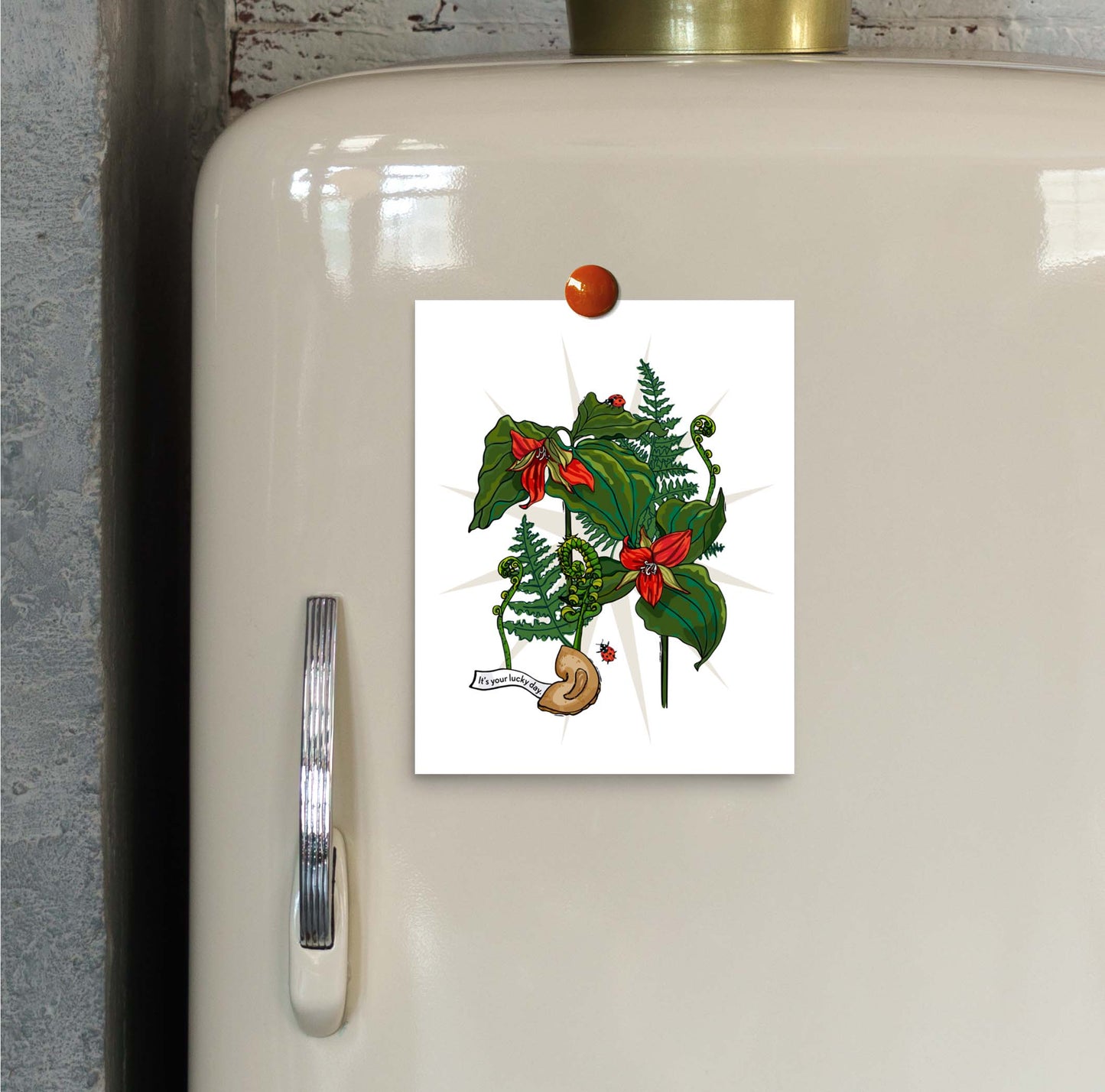 Trillium, Fern, and Fortune Cookie art print hung on an ivory vintage refrigerator door with a magnet.