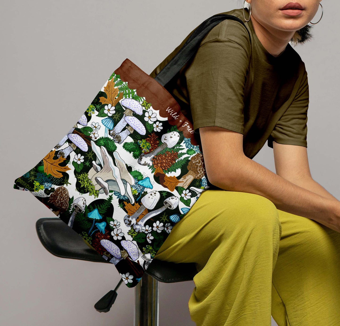 This is a photo of a woman with the tote bag on her shoulder to show the size of the bag.