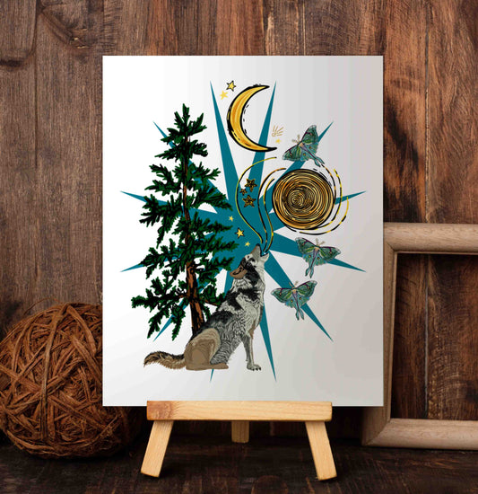 Wolf Moon and Moths art poster on a wooden easel set against a wood-paneled wall.