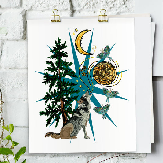 Wild Wolf Moon art print hanging from a white bring wall with gold clips.