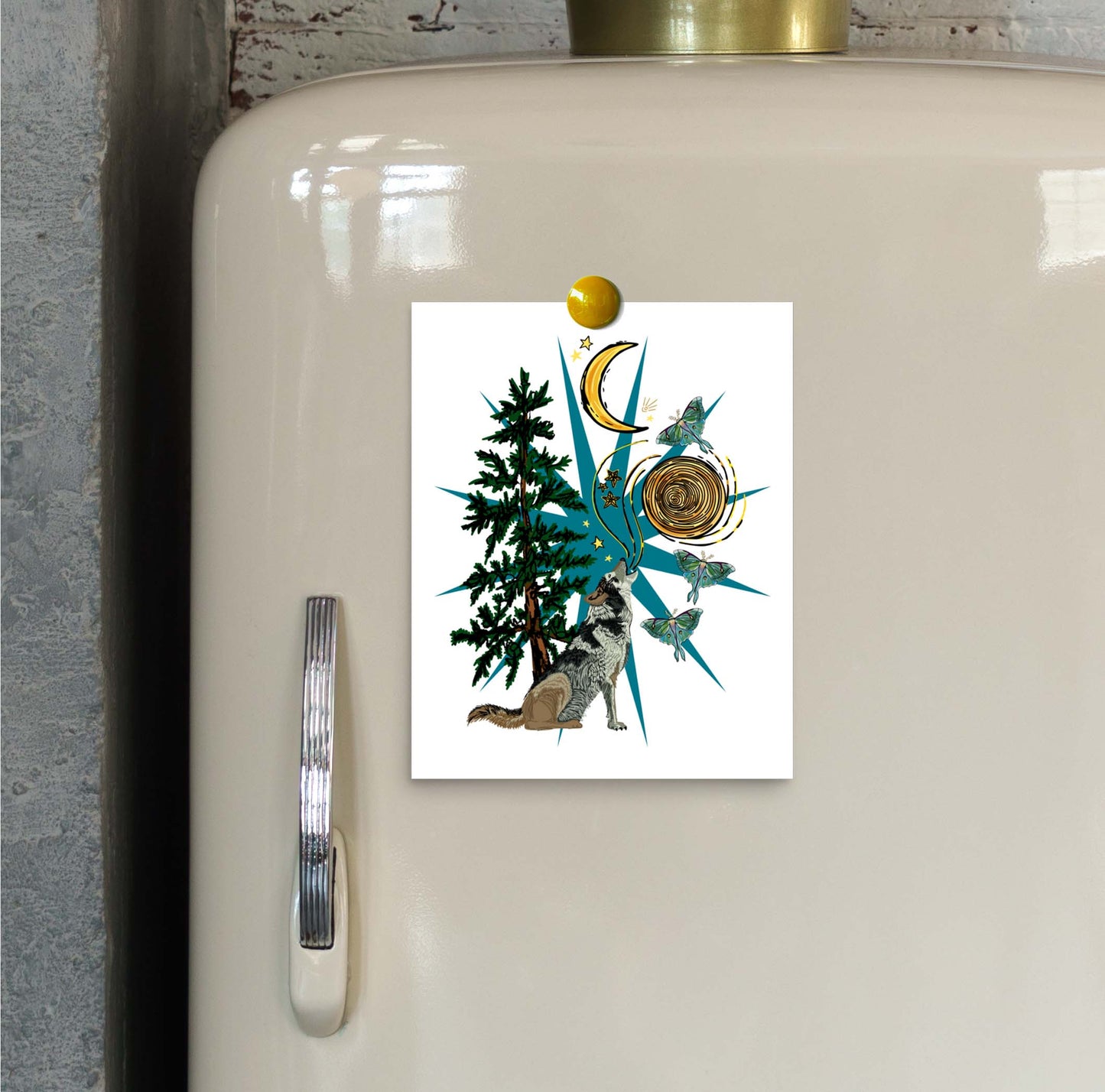 Wolf Moon and Moths art print hung on a refrigerator door with a magnet.