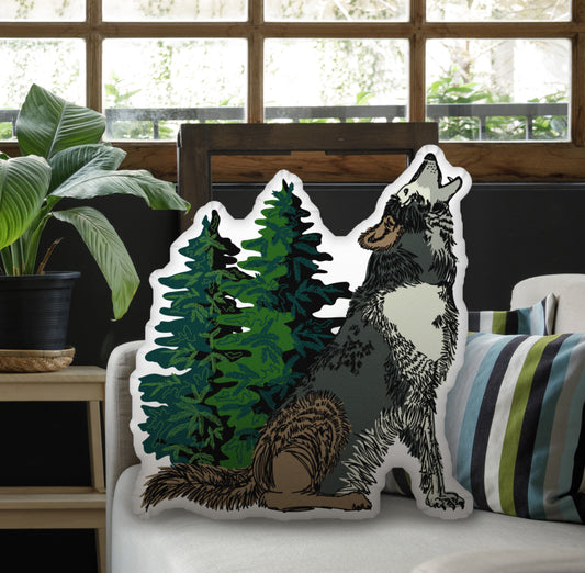 Wolf pillow on a couch in a studio with plants.