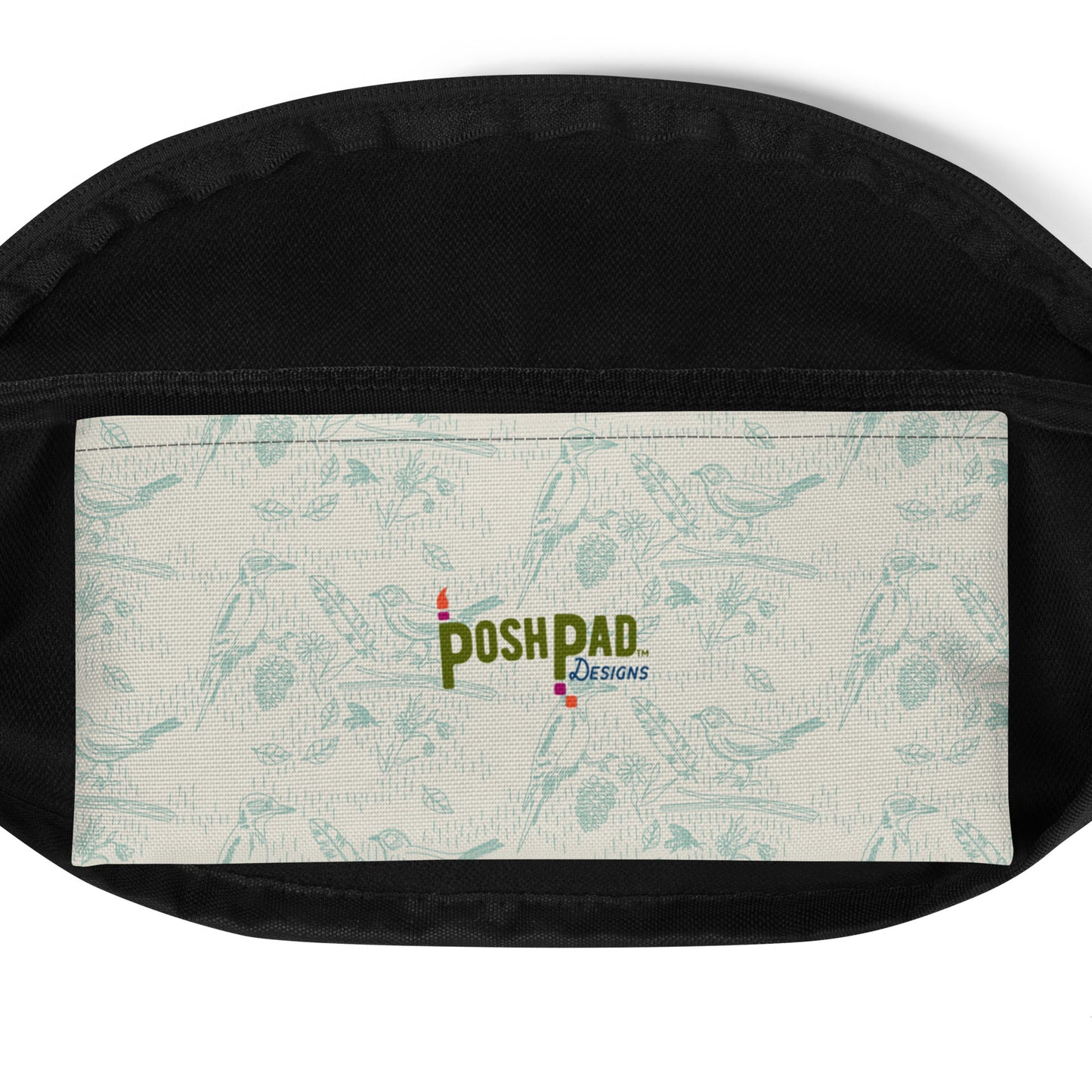 Interior pack pocket. It has a blue bird and feather pattern with the Posh Pad logo in the middle.