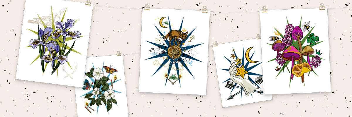 Image of the art prints hanging a string.