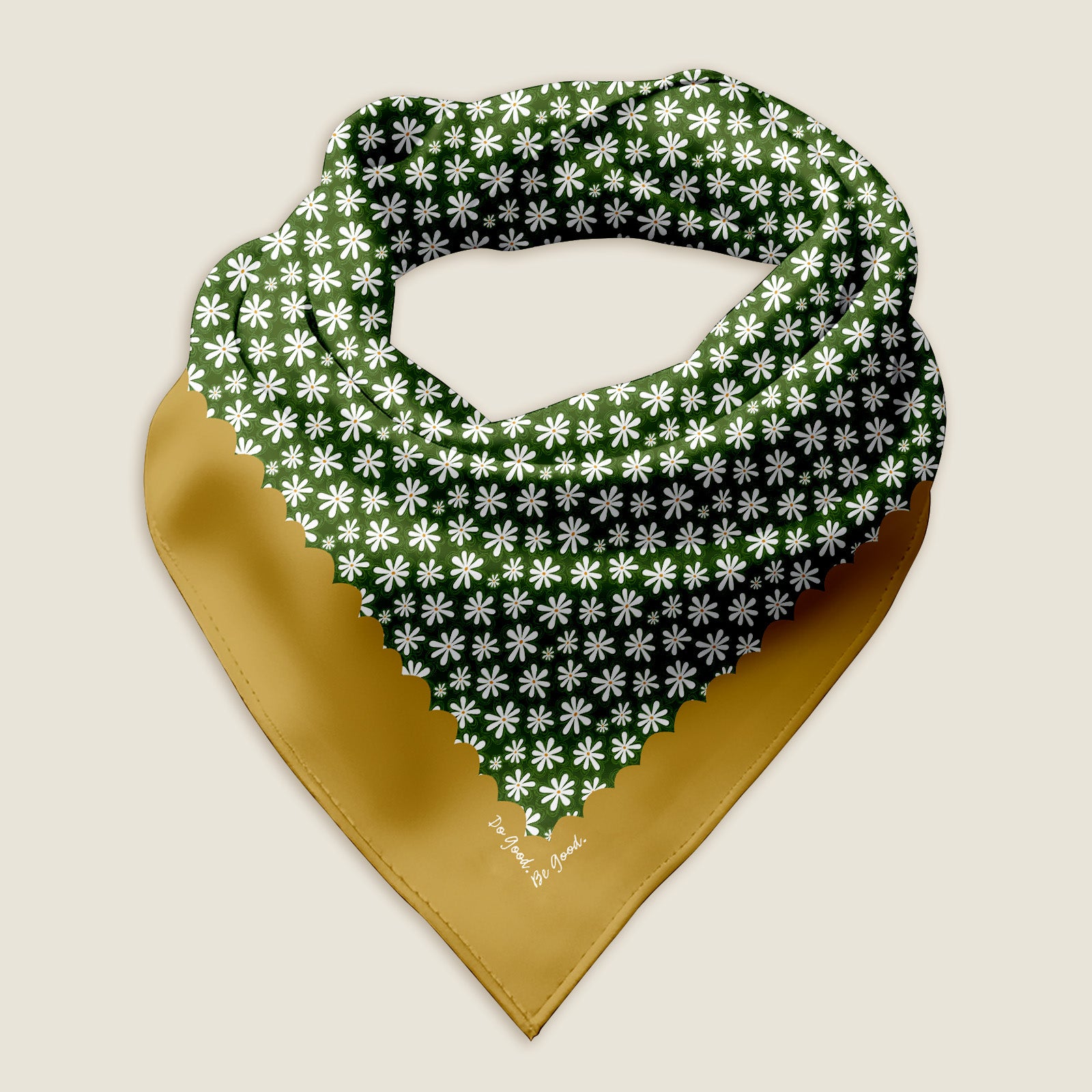 This is an image of the hippie Daisy bandana scarf styled into a wrap showing the hand-drawn artwork of daisy flowers on a green background with a golden yellow border with a white dot pattern. The words "Do Good. Be Good." are nestled into one corner of the border.  The Daisy Flower bandana on an ivory background.