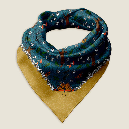 Rabbit meadow bandana scarf on an ivory background.