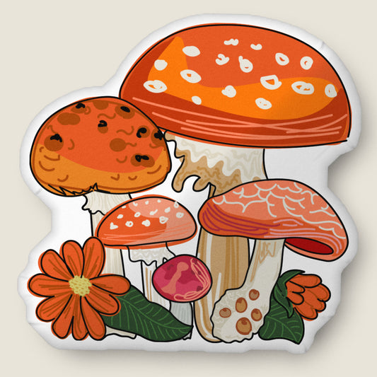 Red mushroom-shaped pillow on an ivory background.