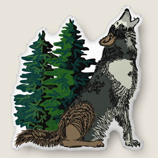 Wolf-shaped pillow on an ivory background.