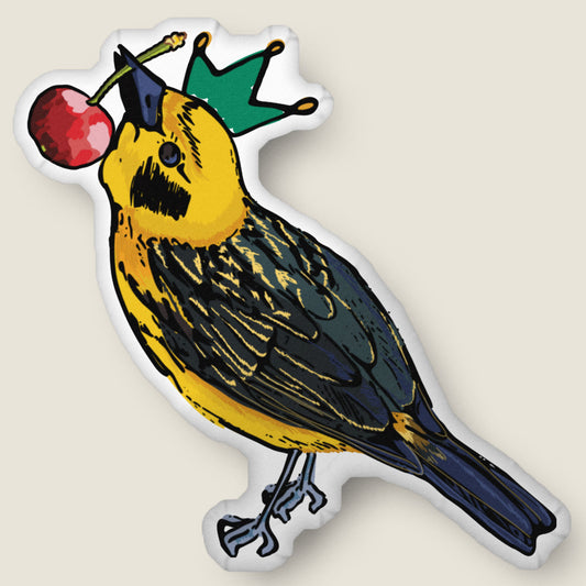 Crowned bird-shaped pillow on an ivory background.