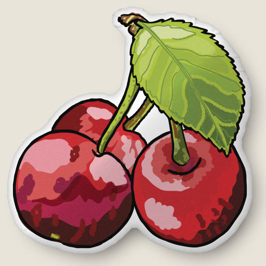 Cherries-shaped pillow on an ivory background.