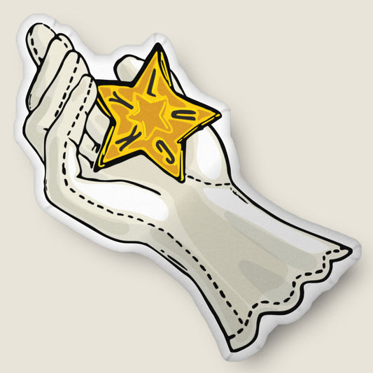 Lucky star giver-shaped pillow on an ivory background.