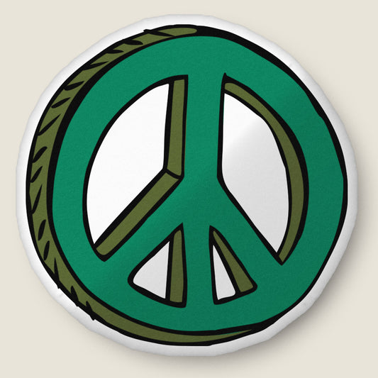 Peace sign-shaped pillow on an ivory background.