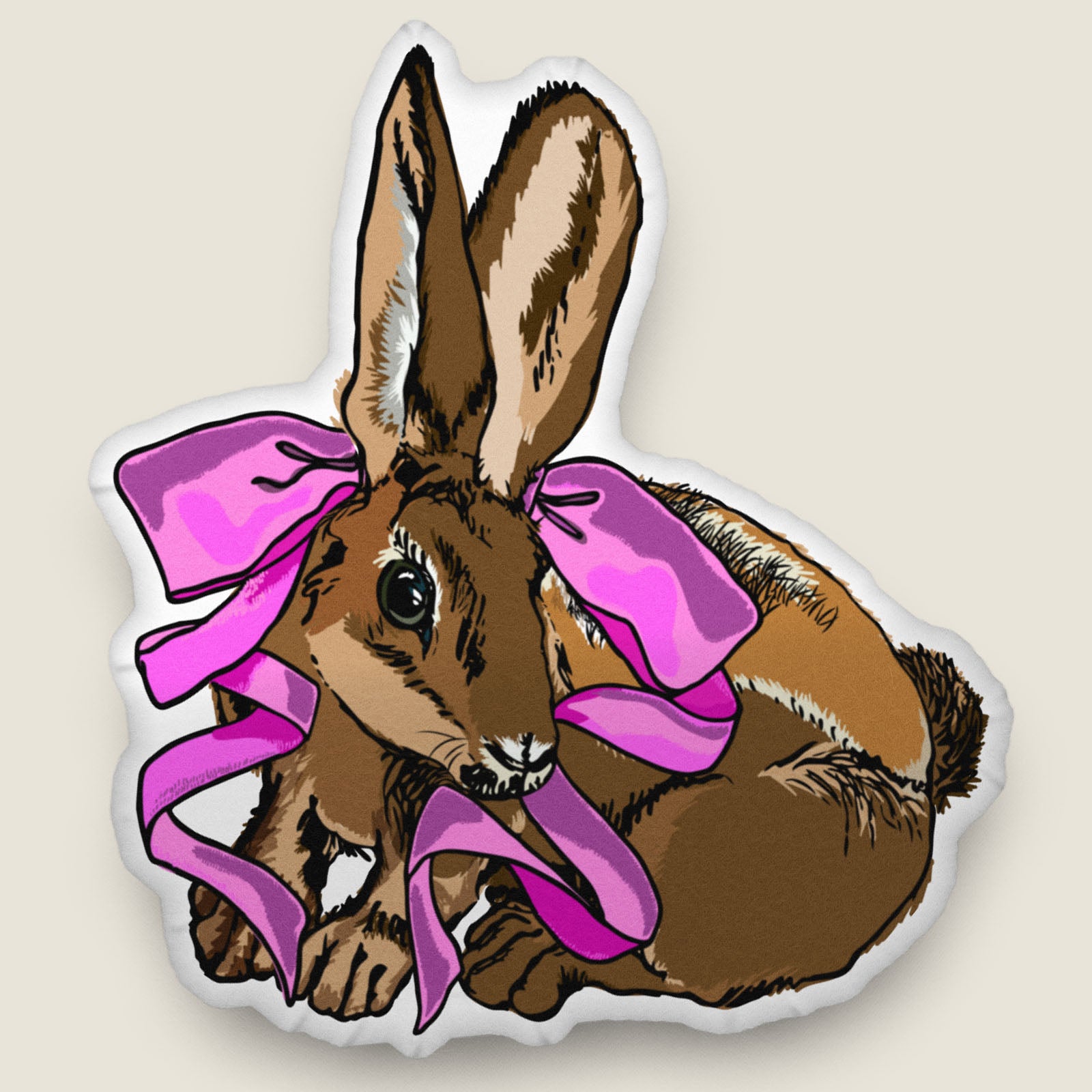 Rabbit-shaped pillow on an ivory background.