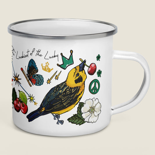 The Aquarius Camp Mug on an ivory background. The artwork is all about good luck symbols. This product is perfect for campsite sips of hot chocolate, coffee, tees, and soups. 