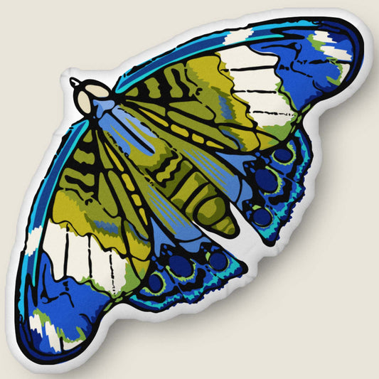 ​​A velvety, plush moth-shaped pillow in rich red and gold tones rests against an ivory background. Hand-drawn bohemian details and soft, sculpted texture make this cozy accent feel both artistic and nature-inspired.