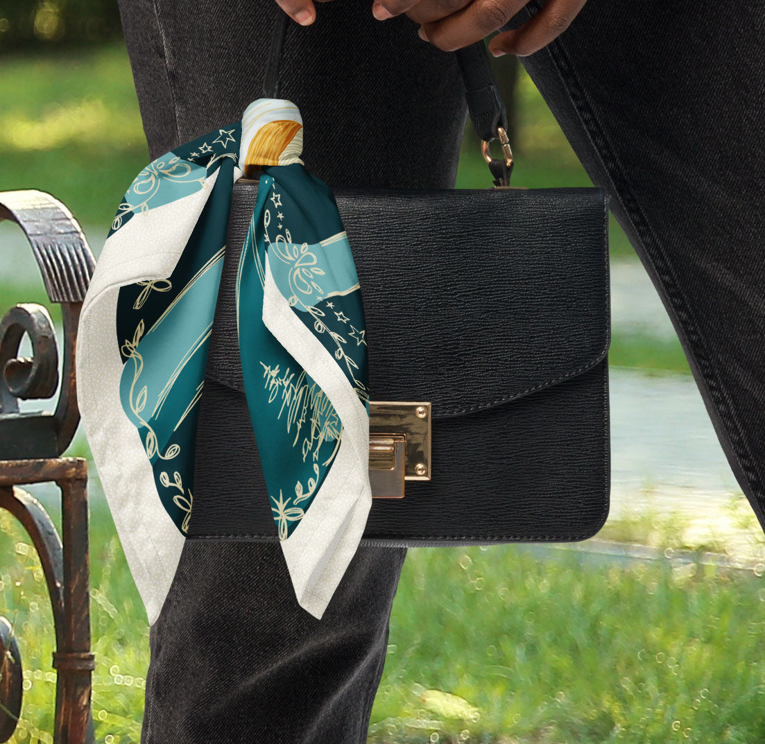 This is a photo of the Blue Moon bandana scarf styled as a purse accessory.