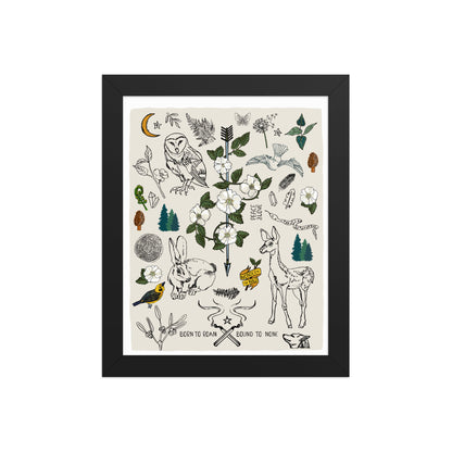 "Born to Roam" artwork with nature-themed illustrations including an owl, rabbit, deer, snake, flowers, wild roses, pine trees, mushrooms, and birds, on an ivory background. 8x10 art print, framed in a black wood frame. 